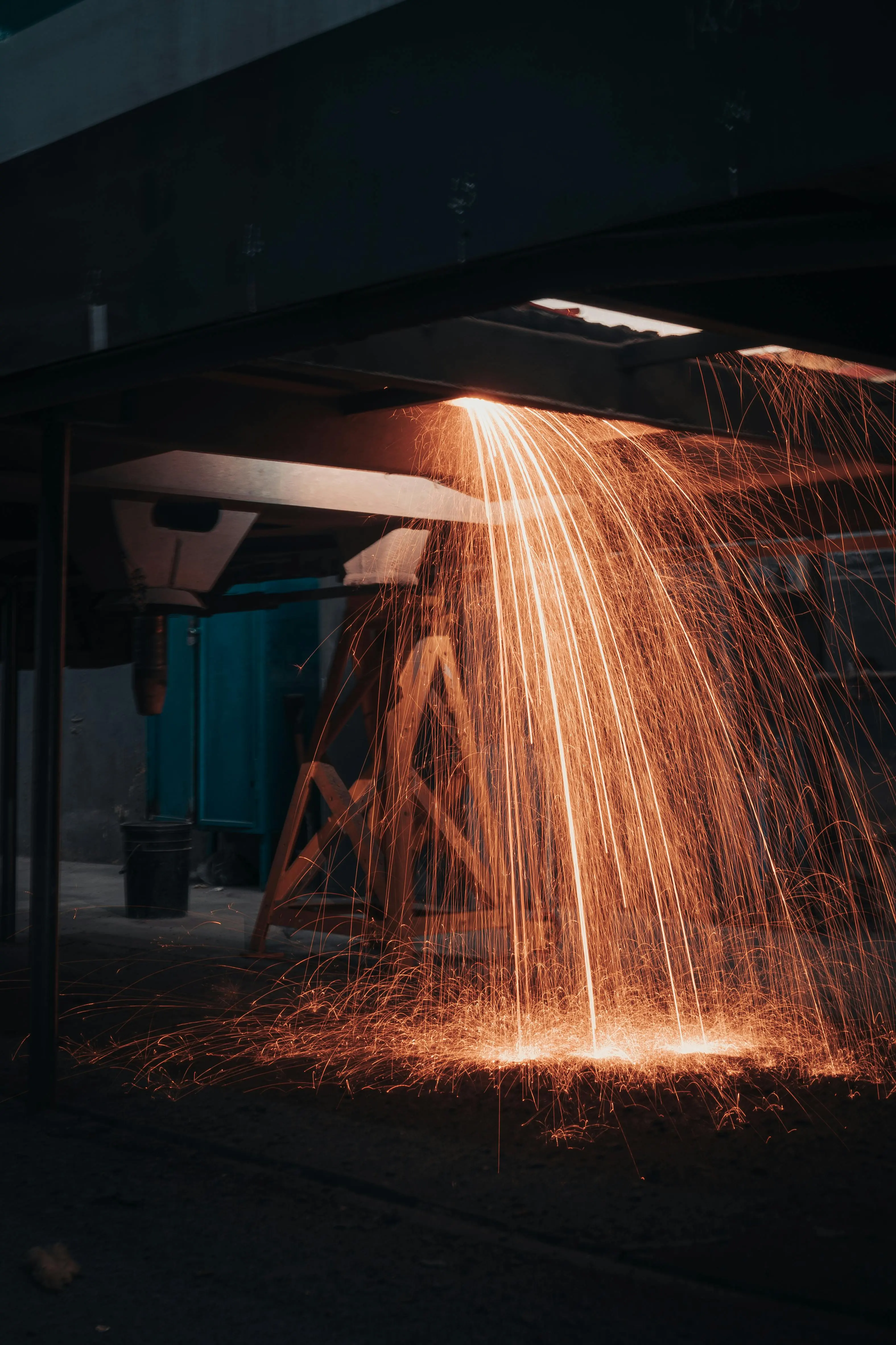 Dramatic sparks cascading during metal fabrication